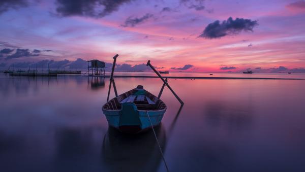 sunrise boat on lake